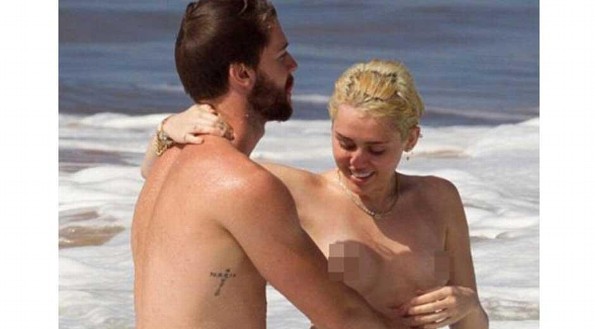 Miley Cyrus pasea en topless junto a su novio en Hawaii